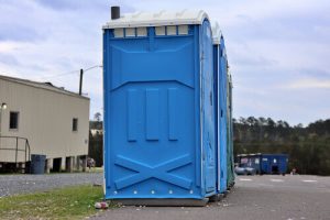 porta potty next to road outside