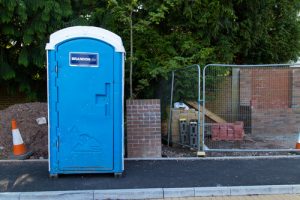 porta potty next to road outside